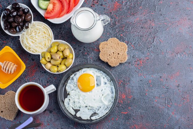 Traditional rich breakfast table with variety of foods. 