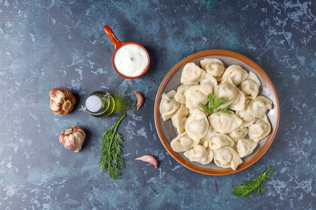 Traditional russian pelmeni or dumplings with meat.