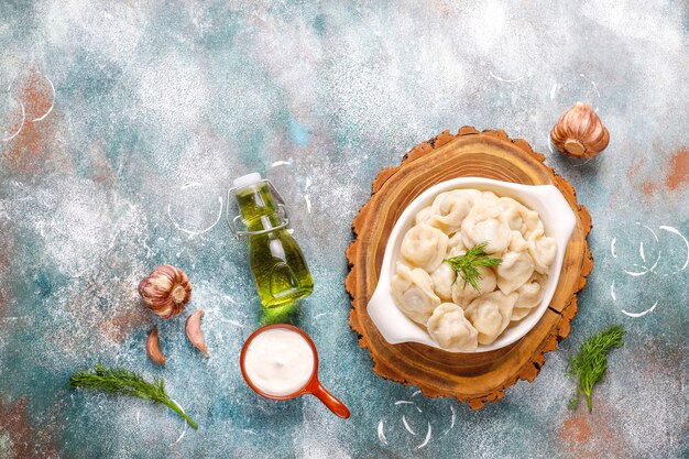 Traditional russian pelmeni or dumplings with meat.