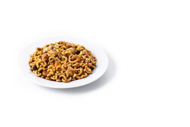 Traditional Spanish fideua Noodle paella isolated on white background