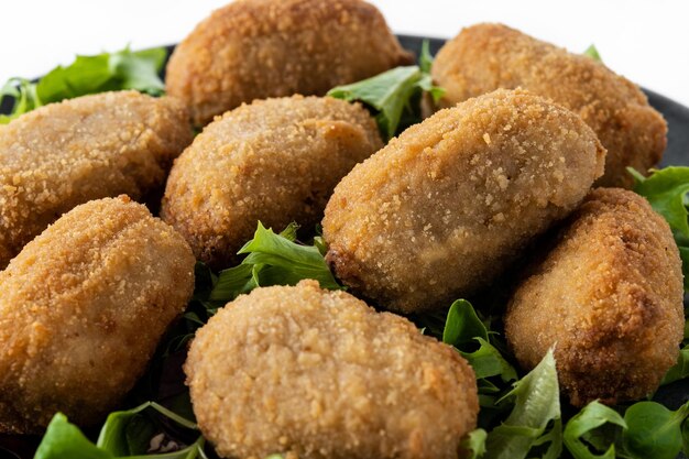 Traditional spanish fried croquettes isolated on white background