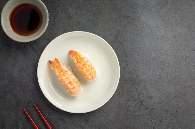 Traditional sushi on dark surface