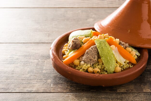 Premium Photo Traditional Tajine With Vegetables Chickpeas Meat And Couscous Isolated On White Surface Copy Space