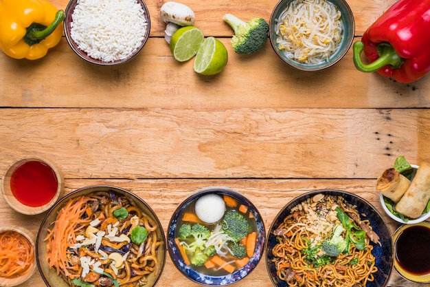 Traditional thai food on the bottom and top wooden desk