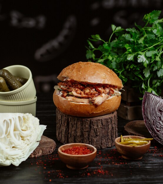 Traditional turkish kebab burger, bread bun stuffed with grilled meat and vegetables.