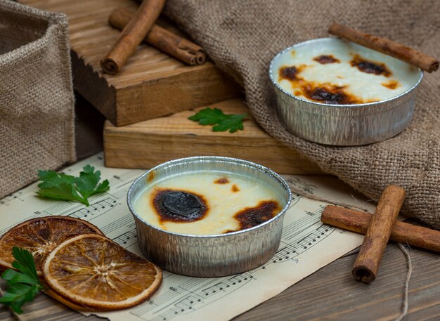 Traditional turkish sutlac, sutlach cooked and served with cinnamon sticks