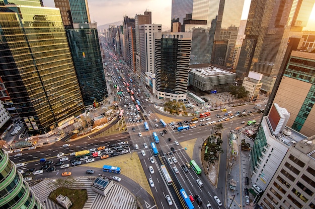 Free photo traffic speeds through an intersection in gangnam, seoul in south korea