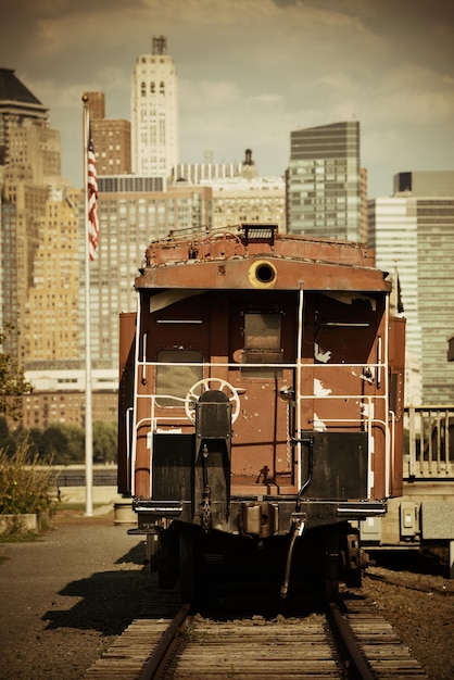 Train and downtown Manhattan in park.