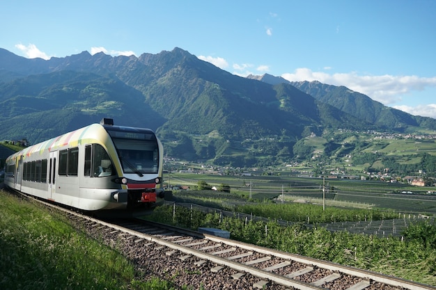 Train running Val Venosta valley route.