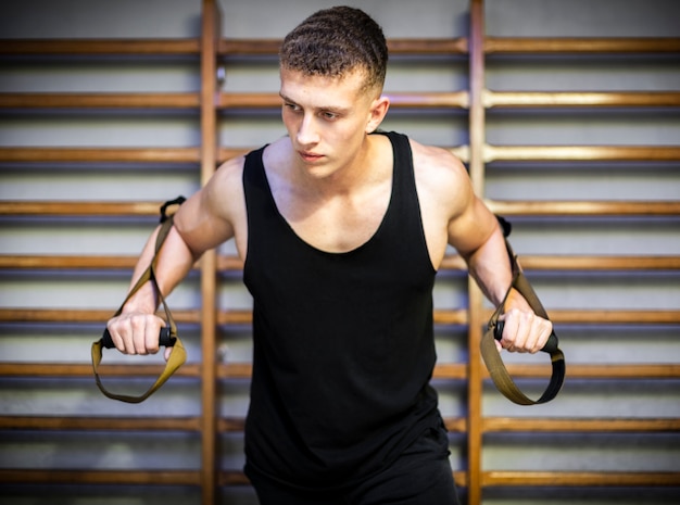 Training arms with trx fitness straps