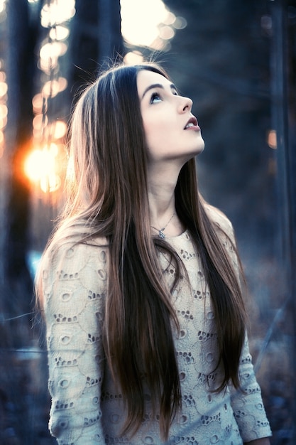 Tranquil  teen looking up at sunset