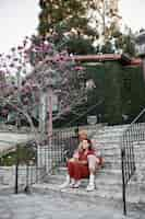 Free photo trans couple sitting on stairs and being affectionate