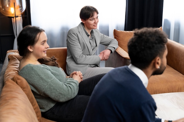 Free photo trans person working at office with colleagues