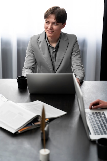 Free photo trans person working at office