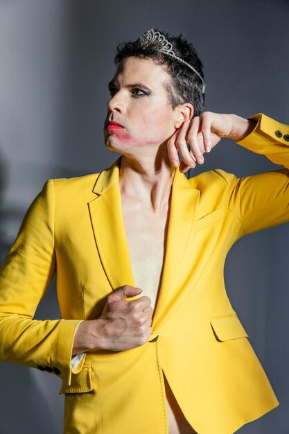 Transgender person wearing yellow jacket