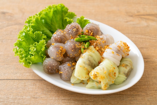 The transparent balls are called saku sai moo or steamed tapioca dumplings ball with pork filling and pork steamed rice parcels