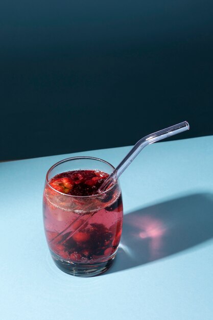 Transparent beverage glass with glass straw