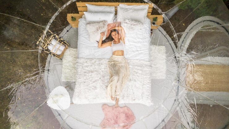 Free Photo transparent bubble tent and woman at glamping