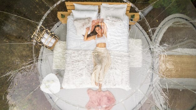 Transparent bubble tent and woman at glamping