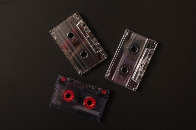 Transparent cassette tapes on black background