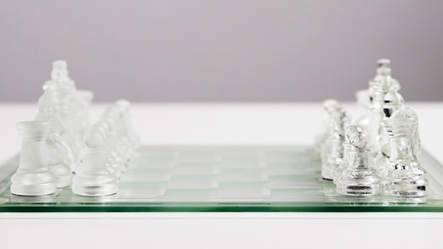Transparent chess pieces on board