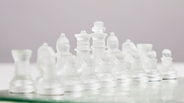 Transparent chess pieces on board