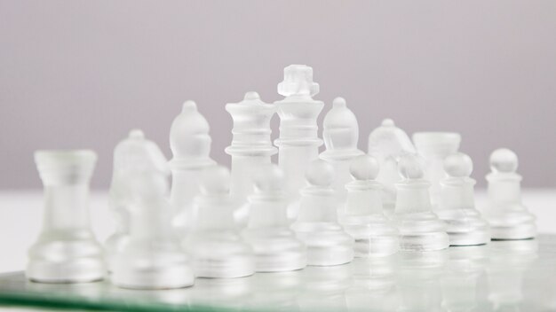 Transparent chess pieces on board