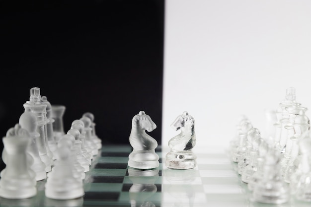 Transparent chess pieces on board