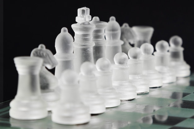 Free photo transparent chess pieces on board