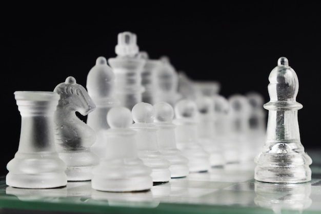 Transparent chess pieces on board