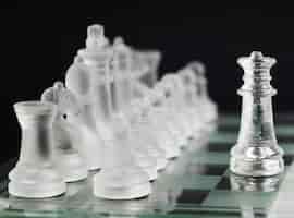 Free photo transparent chess pieces on board