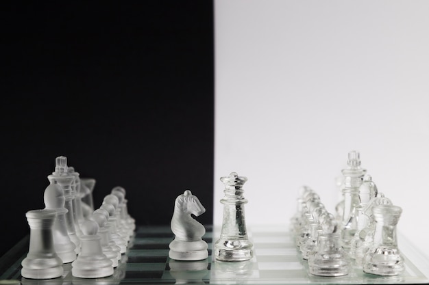 Free photo transparent chess pieces on board