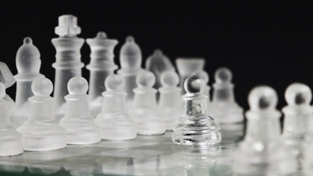 Transparent chess pieces on board