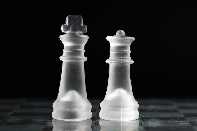 Free photo transparent chess pieces on board