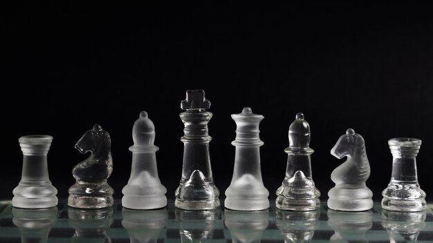 Transparent chess pieces on board