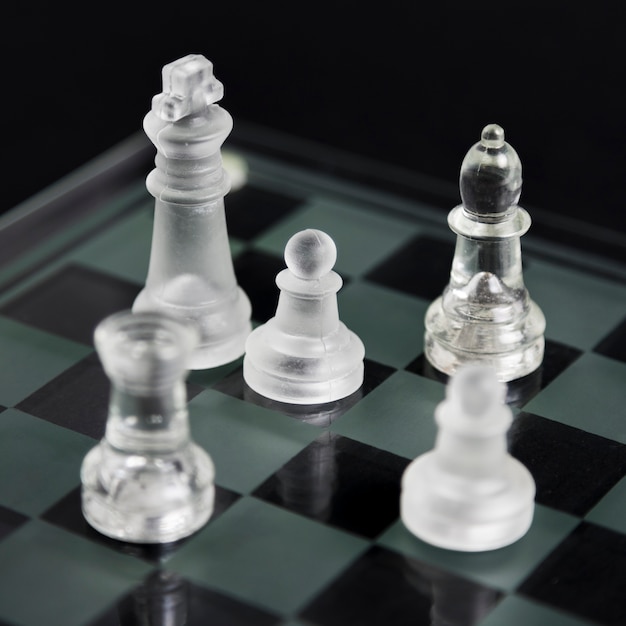 Transparent chess pieces on board