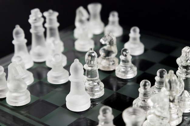 Transparent chess pieces on board