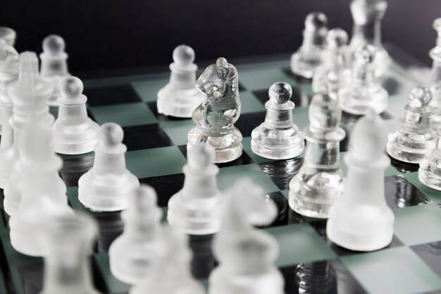 Transparent chess pieces on board