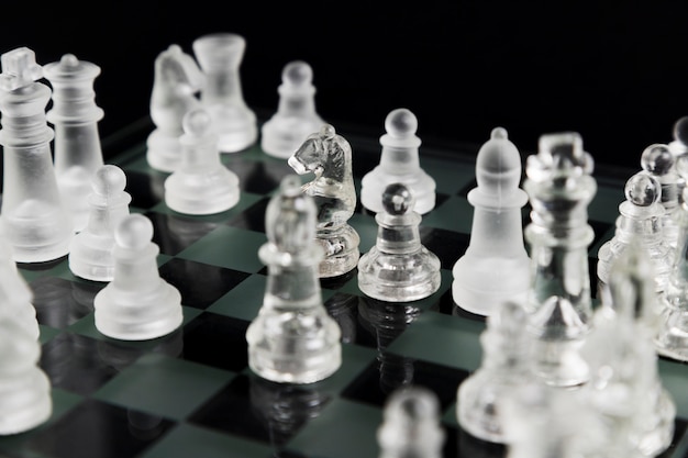 Transparent chess pieces on board