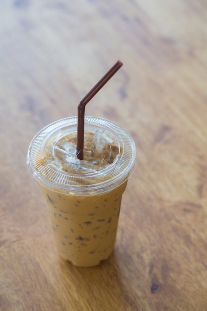 Transparent coffee cup with straw