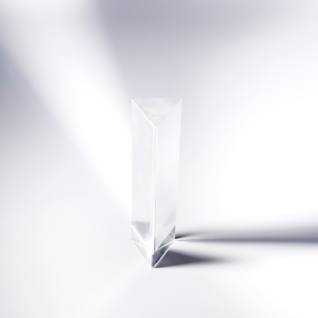 Transparent crystal prism on white background