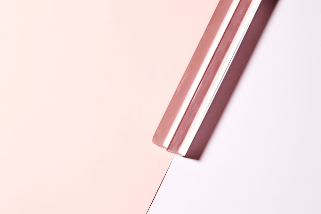 Transparent long crystal on dual pink background