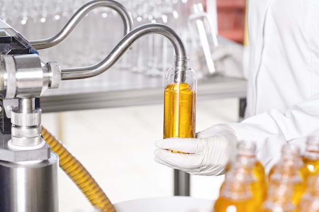 Transparent plastic bottles filled with yellow substance