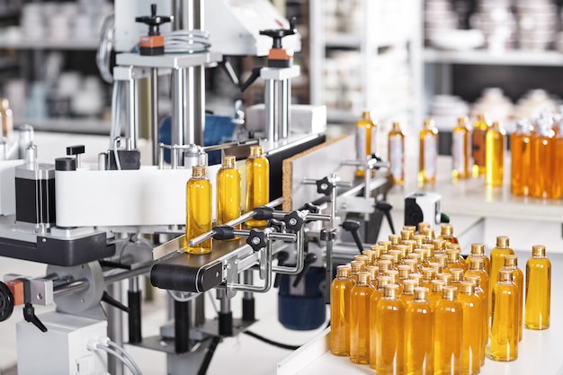 Transparent plastic bottles filled with yellow substance