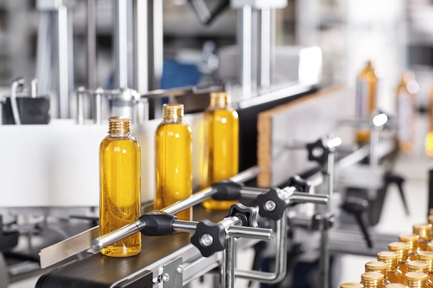 Transparent plastic bottles filled with yellow substance