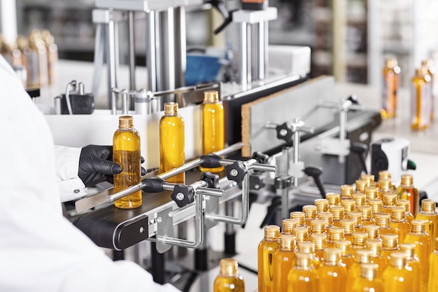 Transparent plastic bottles filled with yellow substance