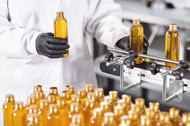 Transparent plastic bottles filled with yellow substance