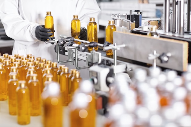 Transparent plastic bottles filled with yellow substance