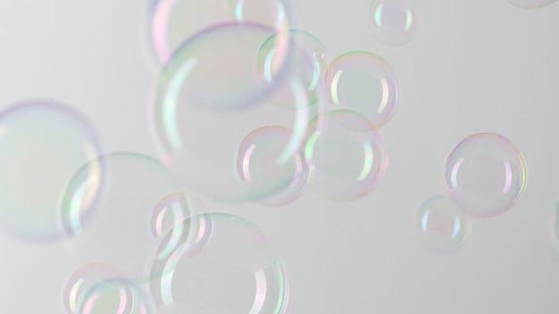 Free photo transparent soap bubble pattern on a gray wallpaper