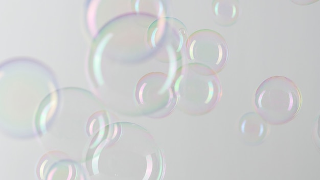 Прозрачный узор мыльных пузырей на серых обоях